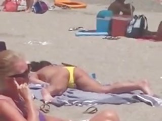 Girl caught masturbating on the beach